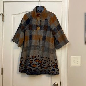 This pea coat was designed by Luii. It is a size medium but runs a little large.